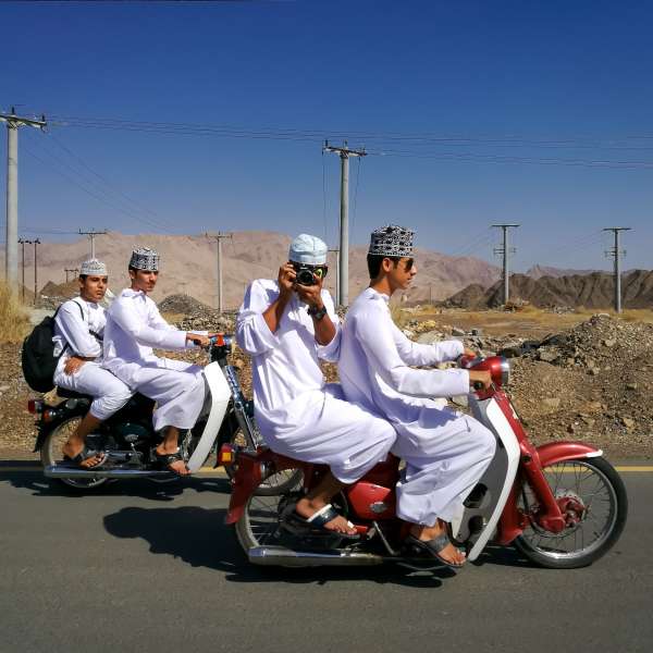 Highschool boys heading home, in Oman. Photographed by Tasneem Alsultan
